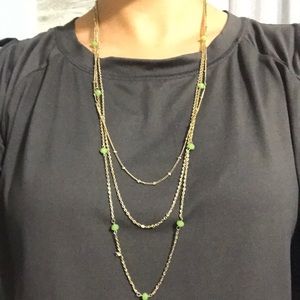 Gold 3 strand necklace with light green balls